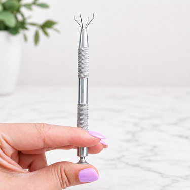 Model Holding Earring Grabber Tool in Silver