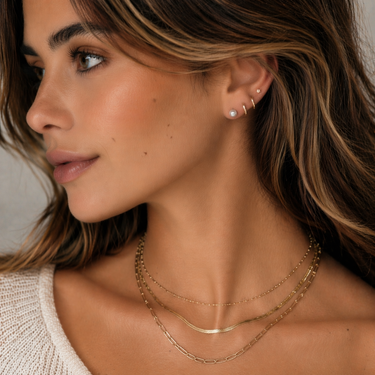 Plated Chaos Jewellery Model Wearing 925 Sterling Silver Stud Earrings with 6mm Freshwater Pearls, Layered With Other Gold Plated Jewellery