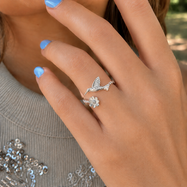 Plated Chaos Model Wearing 925 Sterling Silver CZ Wildflower and Hummingbird Adjustable Ring