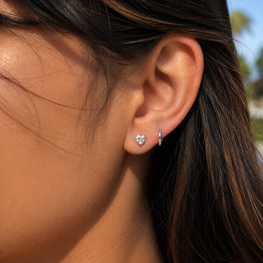 Plated Chaos Model Wearing 925 Sterling Silver & Genuine White Topaz Soft Power Heart Stud Earrings