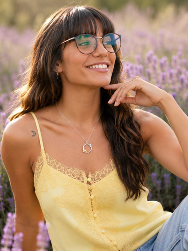 Plated Chaos Model Sitting in a Lavender Field Wearing 925 Sterling Silver Secret Garden Necklace