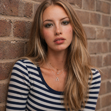 Plated Chaos Model Wearing Sterling Silver & Cubic Zirconia Wishbone Glow Necklace